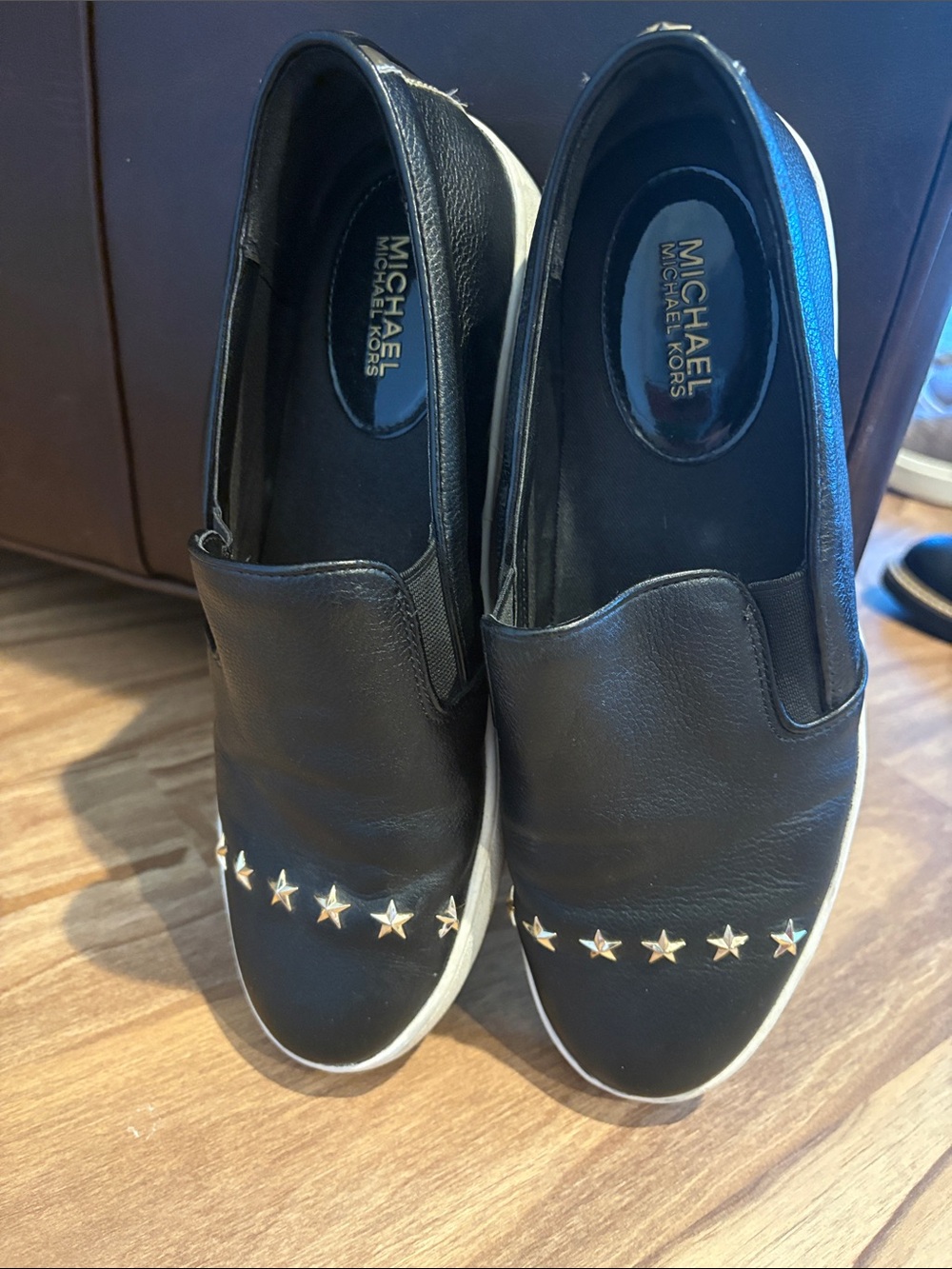 MICHAEL Michael Kors Black Slip-On Sneakers with Gold Star Accents